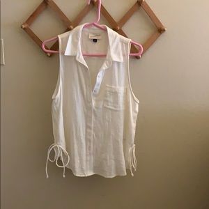 Sleeveless top with side tie detail.